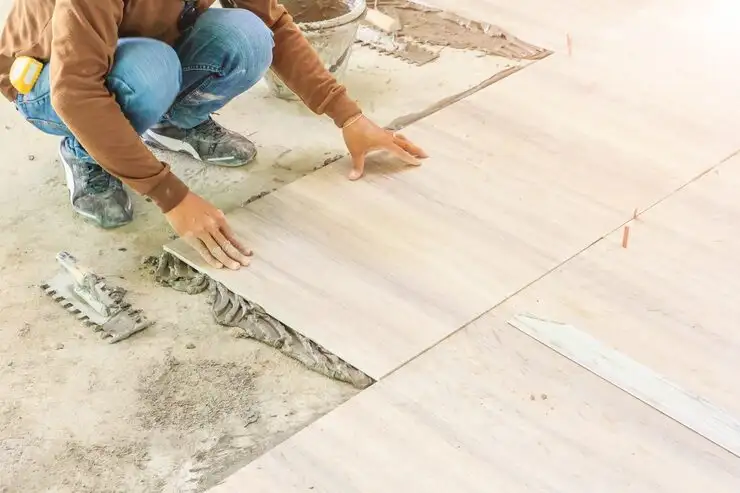 home-improvement-renovation-construction-worker-tiler-is-tiling_29285-1338